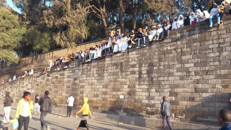 huge-crowd-are-on-top-of-wall-holding-Ethiopian-flag-and-celebrating-Adwa-victory-day