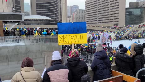 Anti-war-crowd-gathered-to-protest,-supporting-peace-in-Ukraine-in-conflict