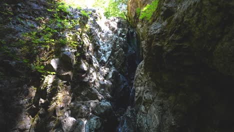 Creek-Waterfall-Splashing-down-rocks---Vancouver-Island,-British-Columbia,-Canada