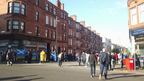 Wide-shot-of-football-fans-crossing-the-road