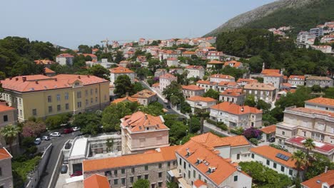 Aerial-drone-forwarding-shot-of-Lastovo,-a-small-town-on-hill-top-near-the-coastline,-Dubrovnik-province,-Croatia-at-daytime