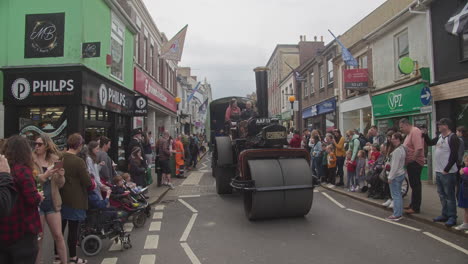 Crowd-Watching-Steamroller-Driven-By-Woman-During-The-Celebration-Of-Trevithick-Day-In-Camborne,-England,-UK