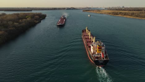 Aerial-forwarding-shot-of-two-Freighter-passing-on-Detroit-River-near-Wyandotte-Michigan,-USA