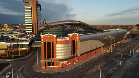 Aerial-View-Of-MotorCity-Casino-Hotel-With-Empty-Road-At-Sunset-In-City-Of-Detroit-In-Michigan,-USA