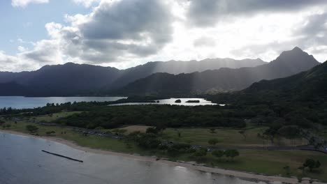 Wide-aerial-panning-shot-of-an-ancient-coastal-fishpond-on-the-island-of-O'ahu,-Hawaii