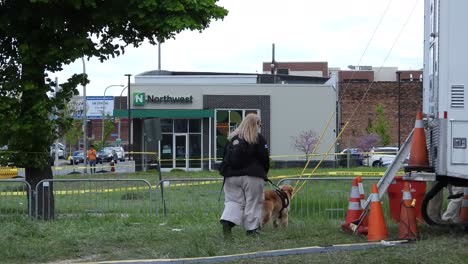 Group-of-assistance-dogs-at-crime-scene-assist-Victim-families-with-traumas,-Buffalo-Race-mass-shooting
