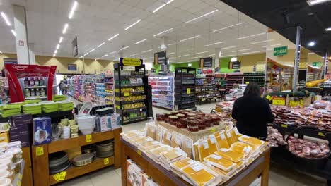 sliding-shot-shows-how-empty-the-huge-supermarket-is-after-covid-struck-and-people-had-to-go-outside-masked-to-do-their-shopping