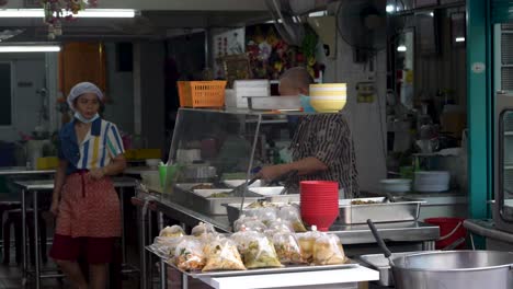 People-working-at-small-restaurant-in-Bangkok