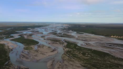 Aerial-landscape-of-Alaskan-nature-terrains-with-melted-ice-water-rivers-in-summer