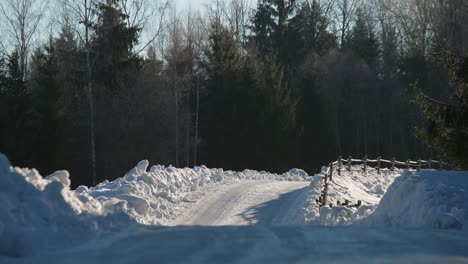 Steady-shot-of-snowy-road-in-winter