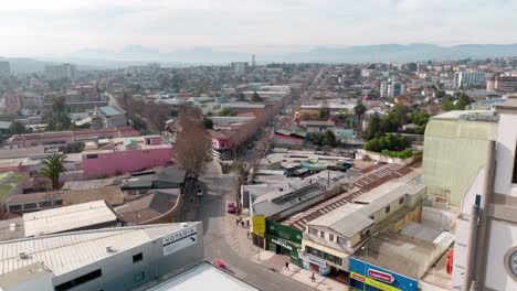 Aerial-view-of-a-church-with-a-clock-in-middle-of-South-American-city-of-Chile
