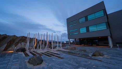 Day-to-night-transition-time-lapse-with-clouds-rolling-across-sky-at-blue-hour