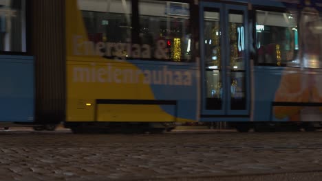 Transit-trains-share-cobble-streets-with-vehicle-traffic-in-Helsinki