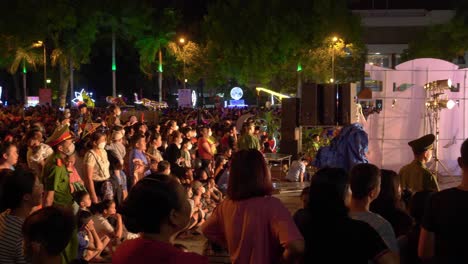 Large-Crowd-Watching-On-As-A-Magician-Finishes-His-Set-As-The-Kids-Leave-The-Stage,-Lang-Son-Province,-Vietnam