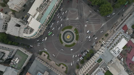 Rotating-aerial-down-shot-of-a-traffic-driving-the-roundabout---Freedom-Square