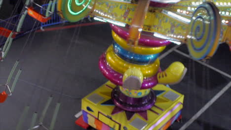 Carnival-Clown-Spinning-Ride-Overhead-View-in-the-Evening