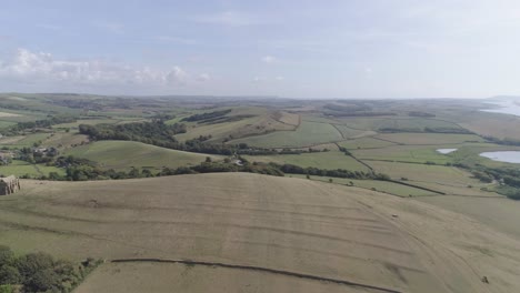 Aerial-tracking-forward-high-above-the-fields-of-Dorset