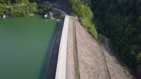 Aerial-take-off-shot-of-Road-diving-water-and-land-where-reservoir-is