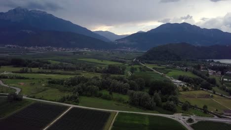 Aerial-panoramic-view-of-Levico-Terme,-Italy,-during-sunrise-with-views-of-the-mountains