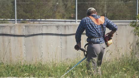 Man-pull-starts-strimmer-in-slow-motion