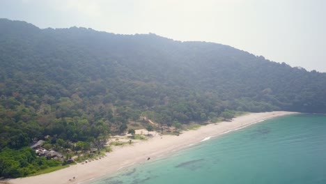 Aerial-view-of-beach-and-natural-forest-in-Thailand---lateral-tracking-panning-shot