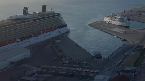 Aerial-overview-of-the-dock-next-to-the-big-cruise-ship-with-a-smaller-ship-close-by