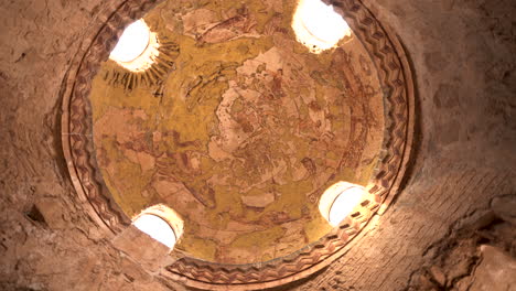Rotating-Shot-of-Dome-Ceiling-Fresco-Above-Bath-Chamber-with-an-Accurate-Representation-of-the-Zodiac-Signs-in-Qasr-Amra-Desert-Castle