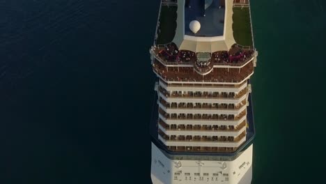 Aerial-close-up-view-from-the-stern-to-the-bow-of-the-cruise-ship-when-sailing-away