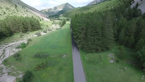 Aerial-view-of-the-road-and-trees-at-Col-du-Noyer