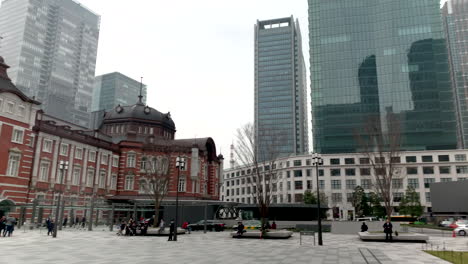 People-walking-around-the-old-building-of-Tokyo-station,-Marunouchi-north-and-south-entrance-exit
