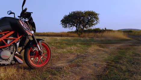 Motorbike-park-in-grass-field-reveal