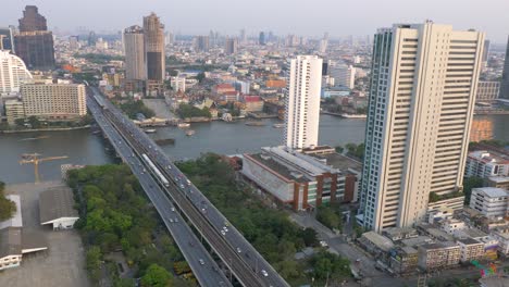 heavy-traffic-at-Saphan-Taksin,-Bangkok,-Thailand