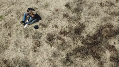 Young-couple-in-love-having-a-picnic-in-a-typical-dutch-heathland
