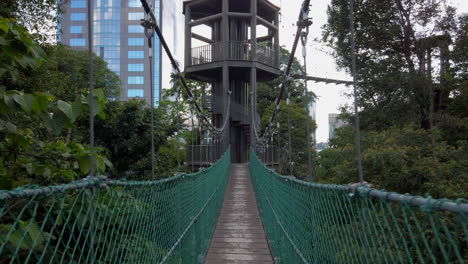 Steadicam-Shot-of-a-hanging-suspension-bridge-at-the-Canopy-Walk-in-Kuala-Lumpur,-Malaysia