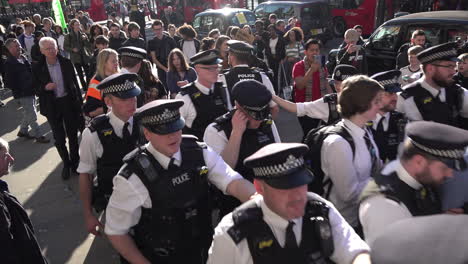 UK-February-2019---A-unit-of-police-officers-surround-and-escort-two-arrested-students-away-from-the-Youth-Strike-4-Climate-protest