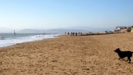 Time-lapse-on-Exmouth-beach-looking-down-the-length-on-a-sunny-day