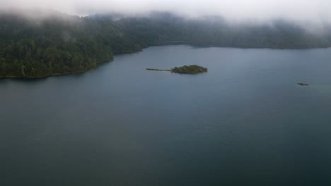 Aerial-shot-of-a-little-island-in-the-Tziscao-Lake,-Montebello-National-Park,-Chiapas