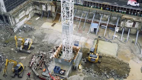 Excavators-working-on-construction-site-at-Millbank-Place,-London,-UK