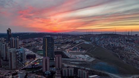Hyperlapse-of-Ankara-downtown-by-drone-at-red-sunset-with-skyscrapers-and-heavy-traffic,-rush-hour,-Turkey