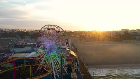 Wonderful-aerial-pull-from-ferris-wheel-in-Santa-Monica-during-sunrise-golden-hour