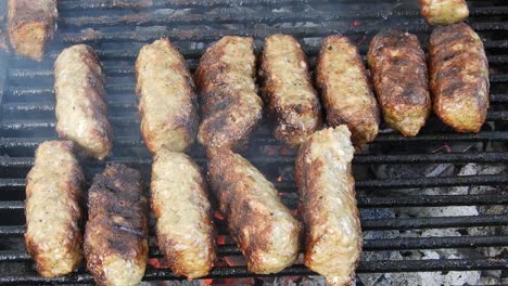 Traditional-food-Meat-Balls-"mici"-on-grill