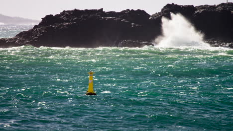 Angry-ocean-with-a-yellow-buoy-in-slow-motion