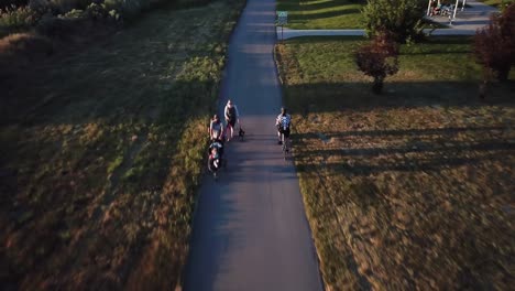 Drone-Shot-following-a-cyclist-riding-his-bicycle-down-a-bike-path