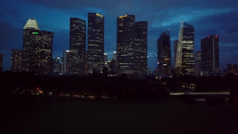 Aerial-approach-drone-shot-of-Singapore-skyscrappers-in-the-evening