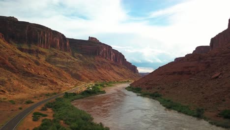 Wide-aerial-shot-over-the-Colorado-River-in-a-beautiful,-scenic-canyon