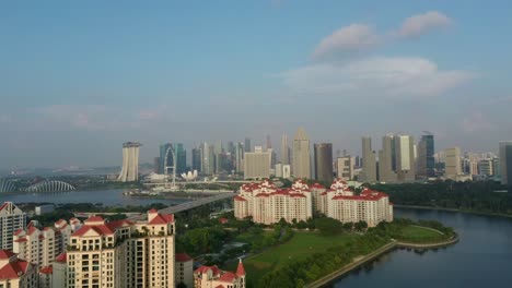 Aerial-drone-shot-of-Costa-Rhu-with-Singapore-skyline-backdrop