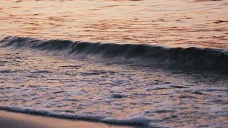 Sea--waves-during-sunset-on-beach,-close-up