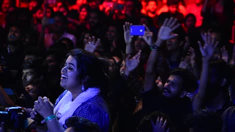 College-students-cheering-during-a-concert-in-their-college