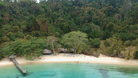 Aerial-drone-shot-of-a-secluded-beach-on-the-edge-of-the-rainforest-in-Borneo