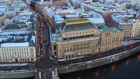 Prague-National-Theatre-and-Old-Town-on-Light-Snowfall,-Drone-Aerial-View,-Czech-Republic